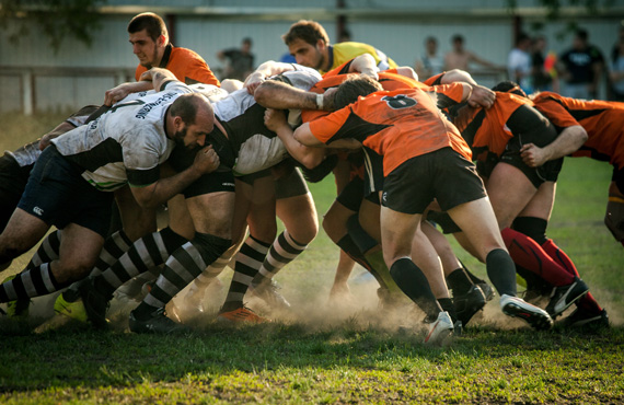 Rugby players in active scrum