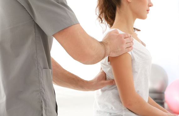Physiotherapist working on shoulder