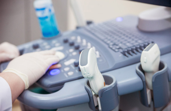 Health care worker using ultrasound machine